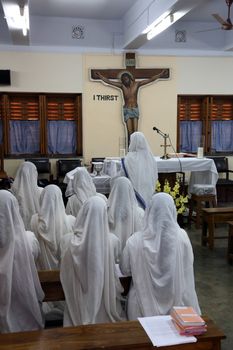 Sisters of Mother Teresa's Missionaries of Charity in prayer in the chapel of the Mother House, Kolkata, India