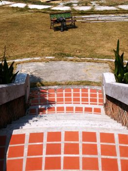 Orange Block Stairway go to the green rattan chair in the Garden
