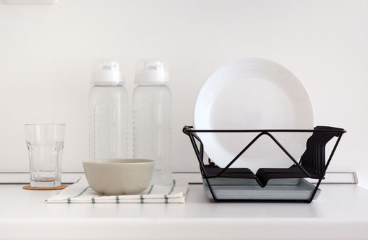 Utensil on white top counter in white kitchen