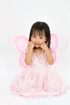 Chinese little girl wearing butterfly custome in plain white background