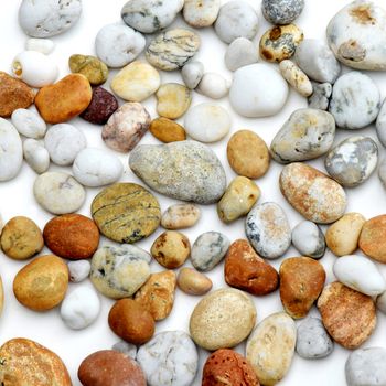 Pebbles from beach sites around the UK in arrangements.