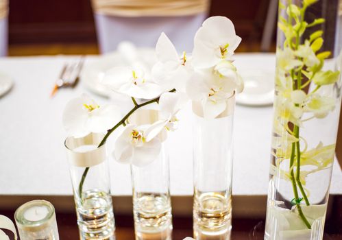 Wedding table decoration with Orchid and glassware