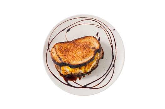 Toasted sandwich with various types of  cheese and beef in ceramic dish isolated on white background with clipping path