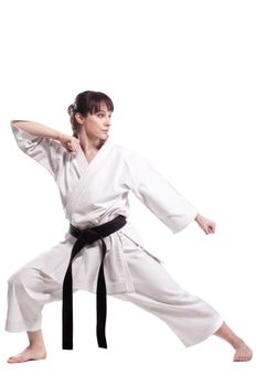 girl exercising karate, against white background