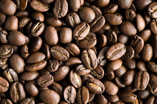 Texture of tasty, rich and fullbody roasted coffee beans.