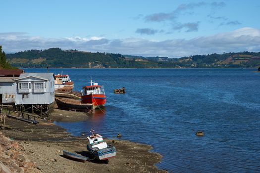 Fishing boats on the coast in Castro, capital of the Island of Chiloé in Chile.