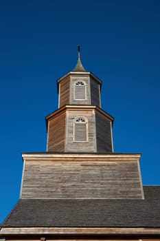 Facade of the historic 19th century wooden church in Nercon on the island of Chiloé in southern Chile.