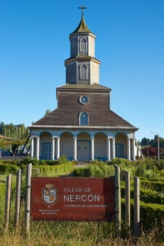 Facade of the historic 19th century wooden church in Nercon on the island of Chiloé in southern Chile.