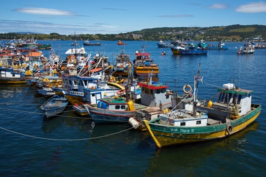 Colourful fishing boats in the coastal town of Quellon on the island of Chiloe in Chile.