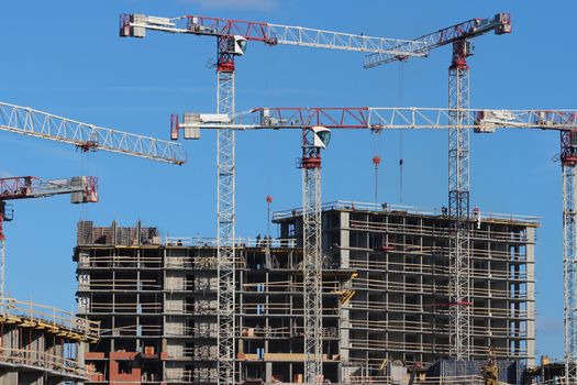 tower cranes on the construction of the building 