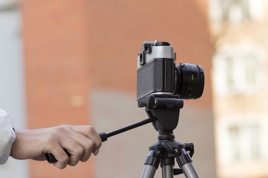 the girl in the hands of is holding the vintage camera
