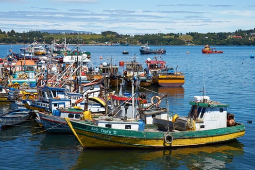 Colourful fishing boats in the coastal town of Quellon on the island of Chiloe in Chile.
