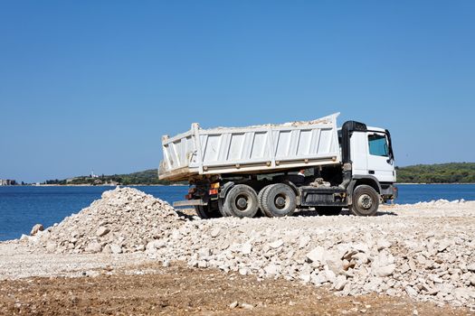 tipper truck unload crushed rocks