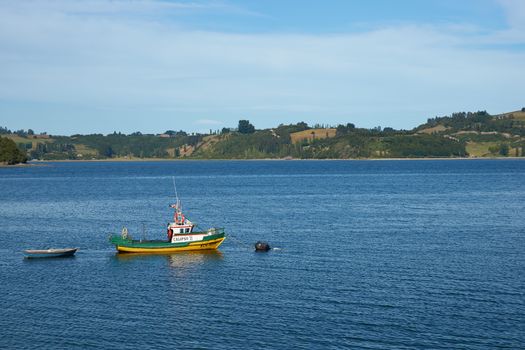 Fishing boat at anchor in the coastal waters off Castro, capital of the Island of Chiloe in Chile.