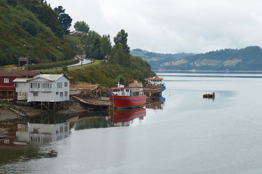 Palafitos. Traditional wooden houses built on stilts along the waters edge in Castro, capital of the Island of Chiloe. These traditional houses are made of wood and usually painted in bright colours.