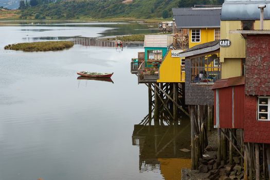 Palafitos. Traditional wooden houses built on stilts along the waters edge in Castro, capital of the Island of Chiloe. These traditional houses are made of wood and usually painted in bright colours.