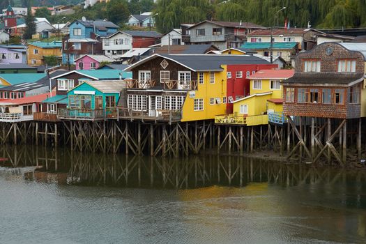 Palafitos. Traditional wooden houses built on stilts along the waters edge in Castro, capital of the Island of Chiloe. These traditional houses are made of wood and usually painted in bright colours.