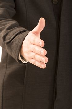 Cropped image of businessman extending hand to shake white background