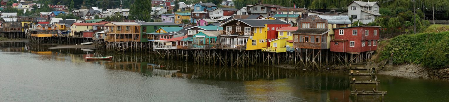 Palafitos. Traditional wooden houses built on stilts along the waters edge in Castro, capital of the Island of Chiloe. These traditional houses are made of wood and usually painted in bright colours.