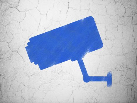 Safety concept: Blue Cctv Camera on textured concrete wall background