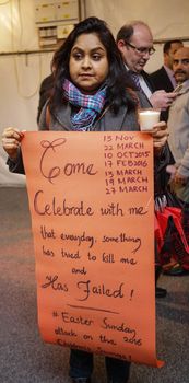 UK, London: A woman holds a sign during a candlelight vigil at the Pakistan High Commission in London on March 29, 2016. The gathering honors the victims of the terrorist attack that left at least 72 dead in Lahore, Pakistan on Easter Sunday. Jamaat-ul-Ahrar, a splinter group of the Taliban, claimed responsibility for the attack.