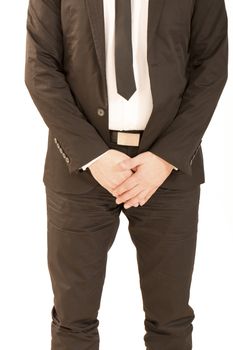 Man with business dress hiding his sex with his hands