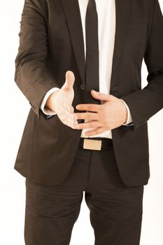 Cropped image of businessman extending hand to shake white background