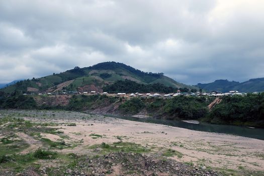 Group of house in ethnic minority residence at Quang Nam village, along Ho Chi Minh trail, houses on mountain terrain, stay seperation in fresh air, green scene on day