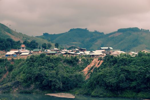 Group of house in ethnic minority residence at Quang Nam village, along Ho Chi Minh trail, houses on mountain terrain, stay seperation in fresh air, green scene on day