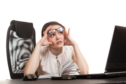 the business woman sits at office table with the laptop