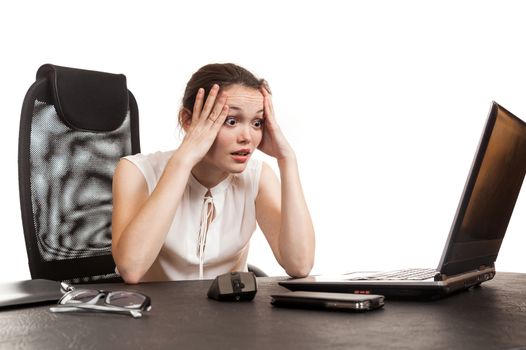 the business woman sits at office table with the laptop