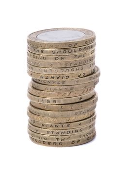 stacked uk two pound coins on white