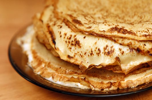 Close up of a pancakes pile with copy-space on the top