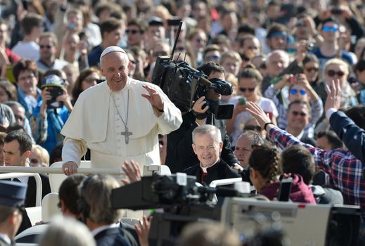 VATICAN: Pope Francis greets the crowd from the popemobile during his weekly general audience at St Peter's square on March 30, 2016, at the Vatican.