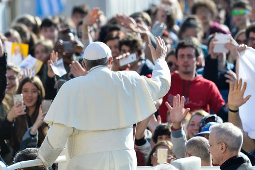 VATICAN: Pope Francis greets the crowd from the popemobile during his weekly general audience at St Peter's square on March 30, 2016, at the Vatican.