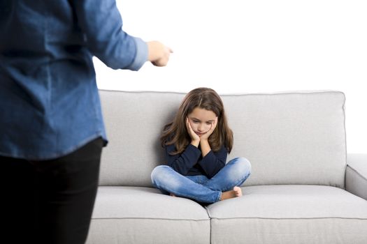 Grown up rebuking a little child for bad behavior