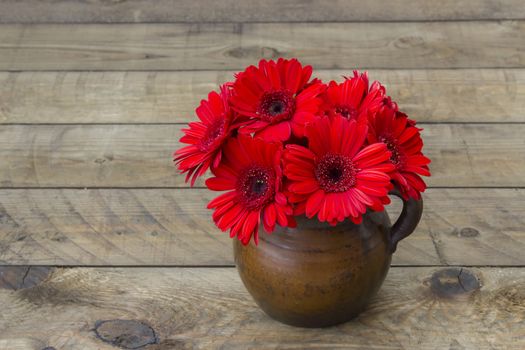 red gerbera flowers in a vase