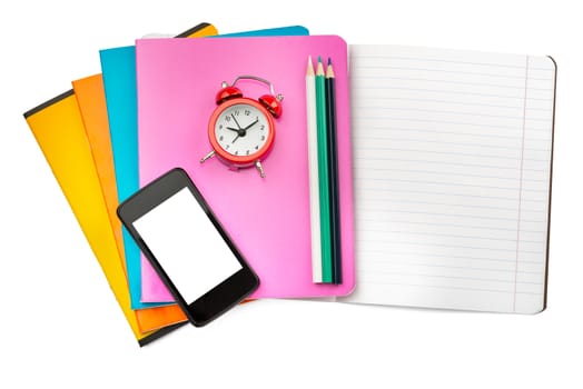 Open notebook with smartphone and alarm clock on isolated white background