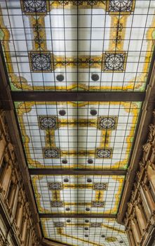Rome, Italy - 2015: the decorated glass ceiling of Galleria Alberto Sordi in Rome finished building in 1922