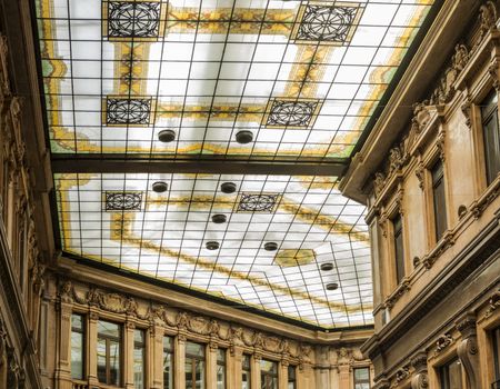 Rome, Italy - 2015: the decorated glass ceiling of Galleria Alberto Sordi in Rome finished building in 1922