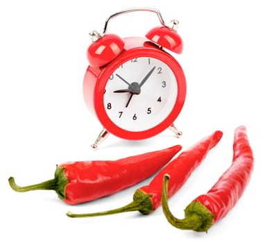 Red hot pepper with alarm clock on isolated white background, side view
