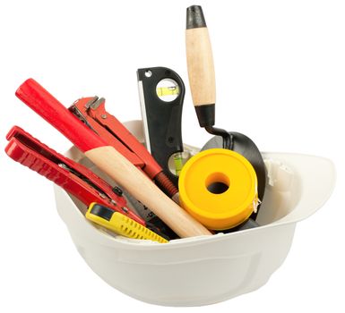 Construction worker supplies including hard hat on isolated white background