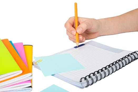 Females hand writing in notebook on isolated white background