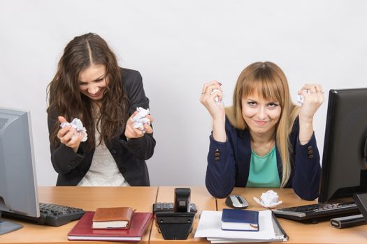 Employees of the office furious crumple paper