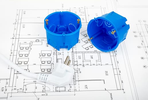 Architecture plan and rolls of blueprints with plug and plastic covers. Building concept