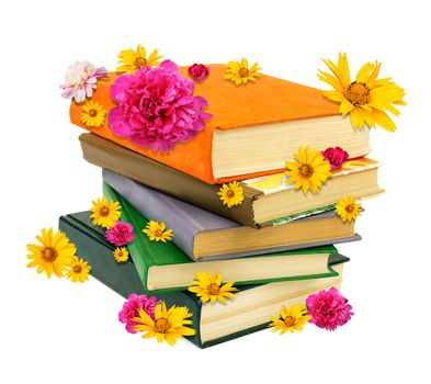 Pile of books with flowers isolated on white background, closeup