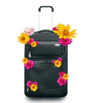 Luggage with flowers isolated on white background