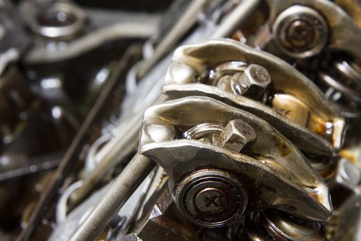 Rockar arms and push rods of an engine being repaired
