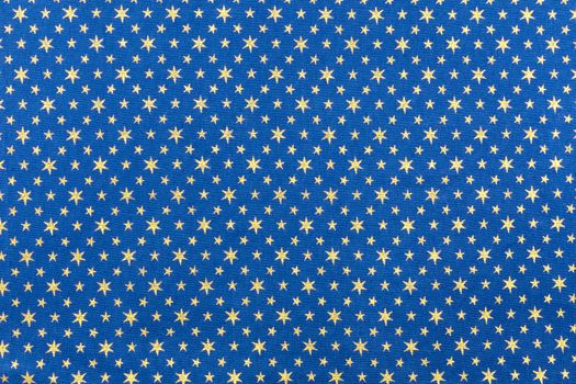 Blue fabrics with golden stars for christmas