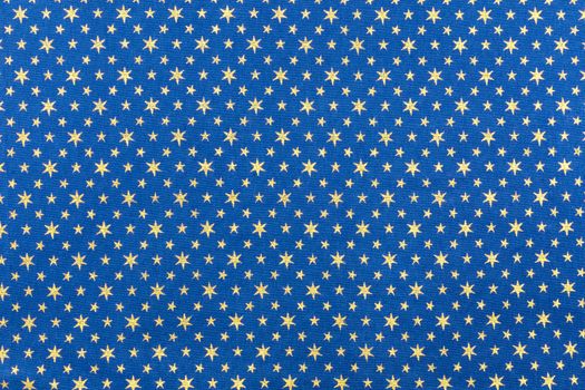Blue fabrics with golden stars for christmas